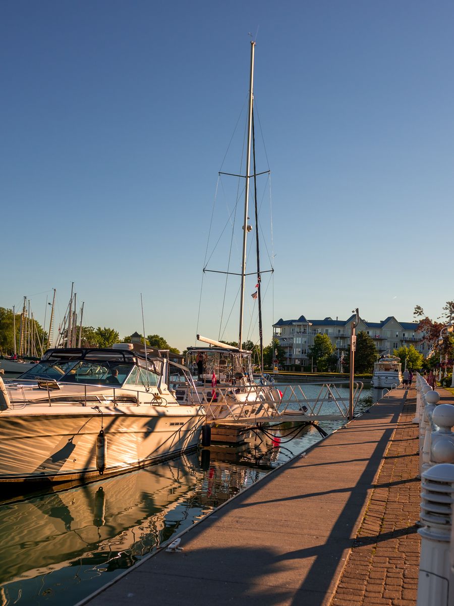 Sailboats moored at Cobourg Harbour marina