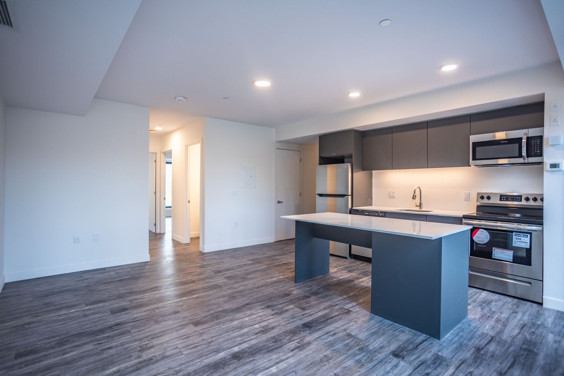 Kitchen island and open living area in a two bedroom suite