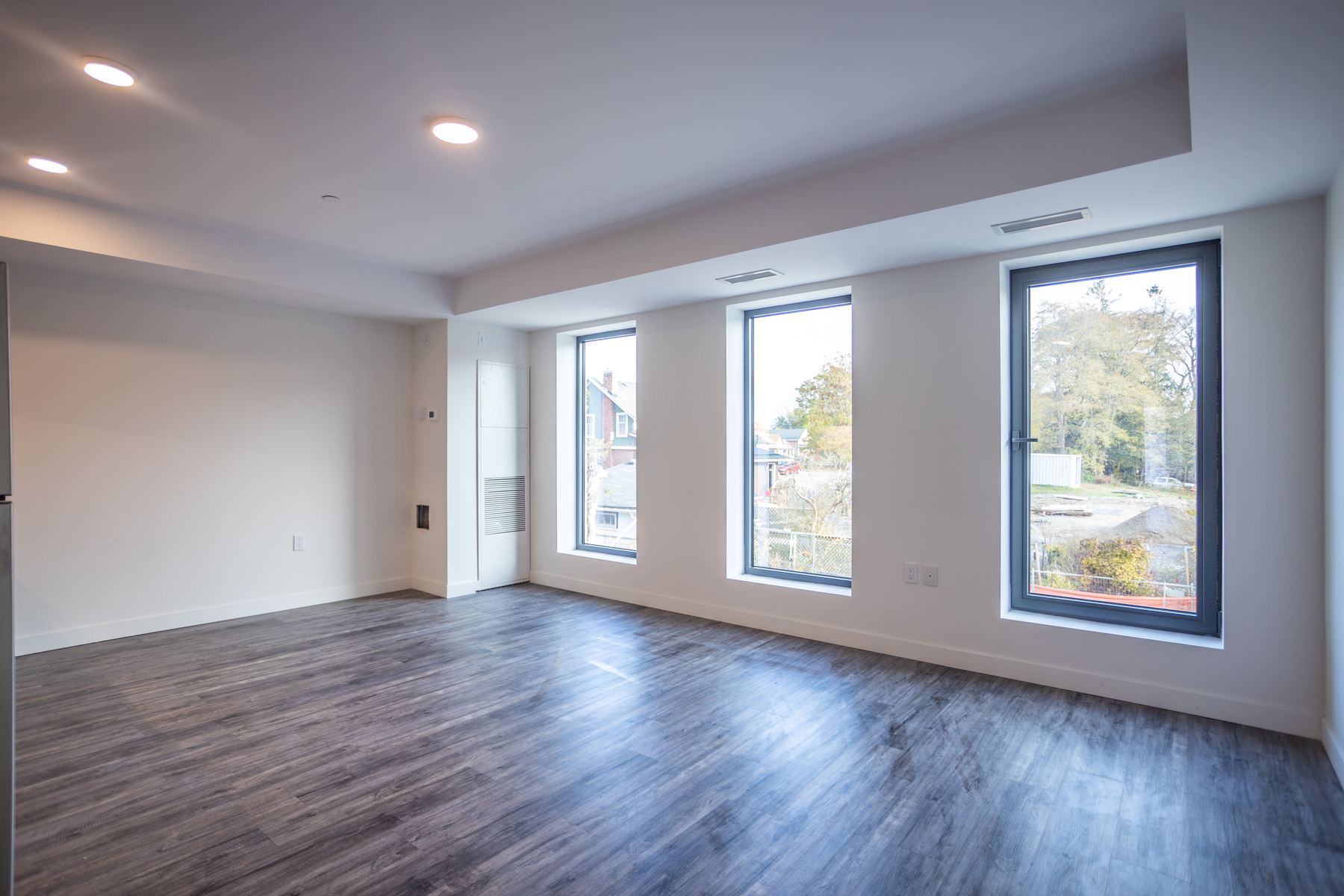 Bright living room with a row of large windows