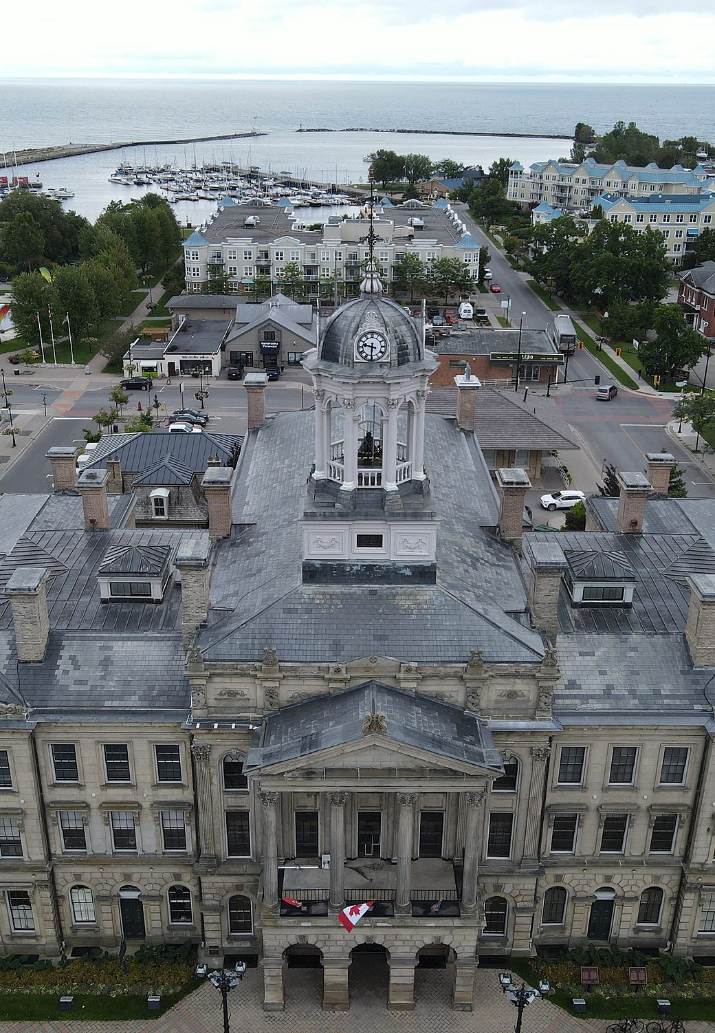 Victoria Hall from the air, with the harbour and Lake Ontario behind it in downtown Cobourg